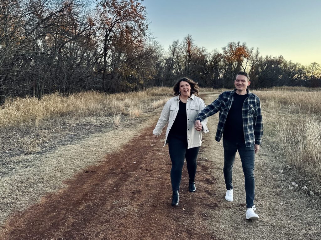Matt and Korri walking on a dirt road.